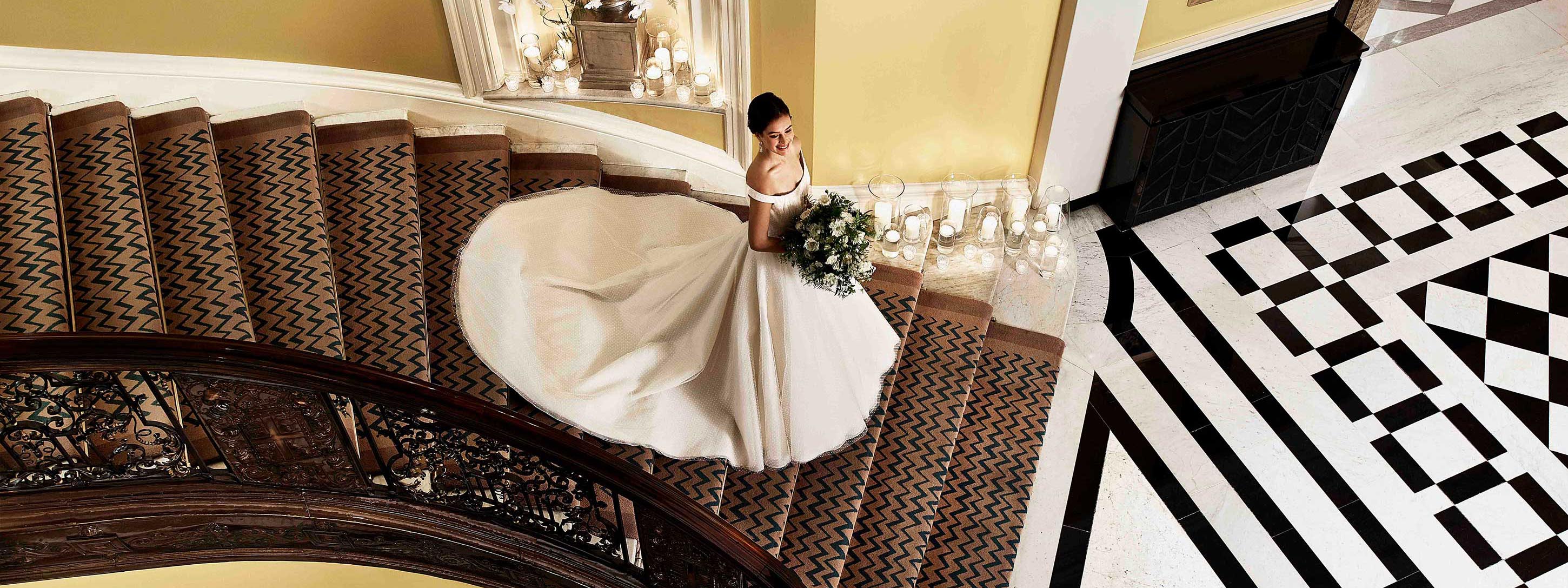 Bride coming down the Claridge's staircase