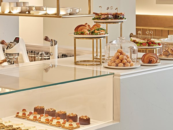 Claridge's Artspace Café counter with cakes and pastries on it.