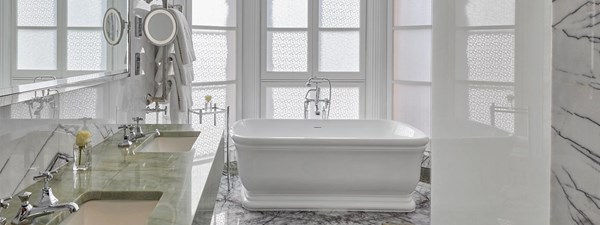 Grand Piano Suite at Claridge's - bathroom view with bathtub, marble floor and marble sinks.