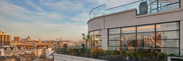 Exterior of The Residence with reflection on windows